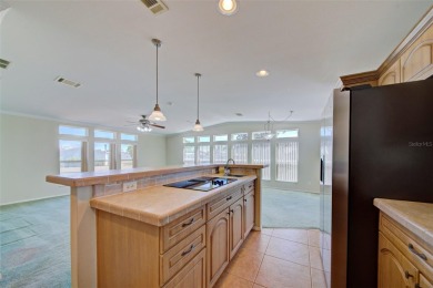 Welcome to your dream abode, nestled on a desirable corner lot on Brookridge Country Club in Florida - for sale on GolfHomes.com, golf home, golf lot