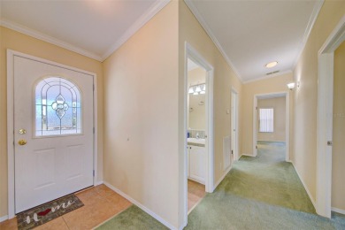 Welcome to your dream abode, nestled on a desirable corner lot on Brookridge Country Club in Florida - for sale on GolfHomes.com, golf home, golf lot