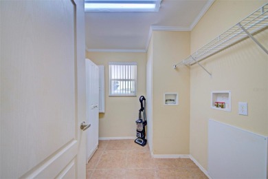 Welcome to your dream abode, nestled on a desirable corner lot on Brookridge Country Club in Florida - for sale on GolfHomes.com, golf home, golf lot