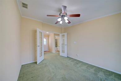 Welcome to your dream abode, nestled on a desirable corner lot on Brookridge Country Club in Florida - for sale on GolfHomes.com, golf home, golf lot