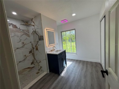 Welcome to your dream retreat in beautiful Lake Estates, FL! on Indian Lake Estates Golf and Country Club in Florida - for sale on GolfHomes.com, golf home, golf lot
