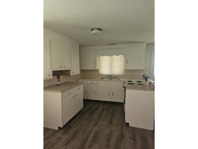 So much potential in this 2 bedroom, 1 bath home.  Roof was new on The Creek Golf Club in South Carolina - for sale on GolfHomes.com, golf home, golf lot
