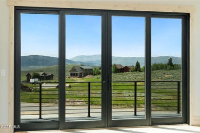 Situated amongst the serene grandeur of Granby Ranch, this on Headwaters Golf Course At Granby Ranch in Colorado - for sale on GolfHomes.com, golf home, golf lot