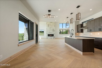 Situated amongst the serene grandeur of Granby Ranch, this on Headwaters Golf Course At Granby Ranch in Colorado - for sale on GolfHomes.com, golf home, golf lot