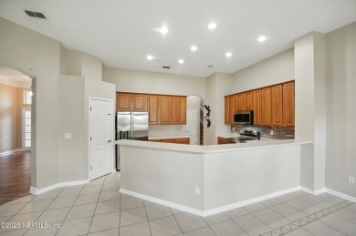 If you enjoy socializing and entertaining, this five-bedroom on Queens Harbour Yacht and Country Club in Florida - for sale on GolfHomes.com, golf home, golf lot