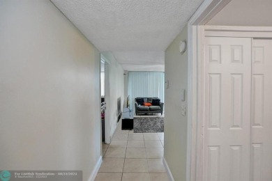 Spacious 2 bed, 2 bath condo with a private balcony and golf on Inverrary Country Club in Florida - for sale on GolfHomes.com, golf home, golf lot