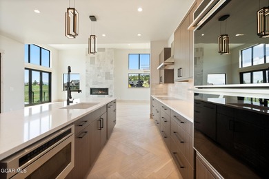 Situated amongst the serene grandeur of Granby Ranch, this on Headwaters Golf Course At Granby Ranch in Colorado - for sale on GolfHomes.com, golf home, golf lot