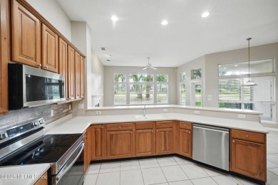 If you enjoy socializing and entertaining, this five-bedroom on Queens Harbour Yacht and Country Club in Florida - for sale on GolfHomes.com, golf home, golf lot