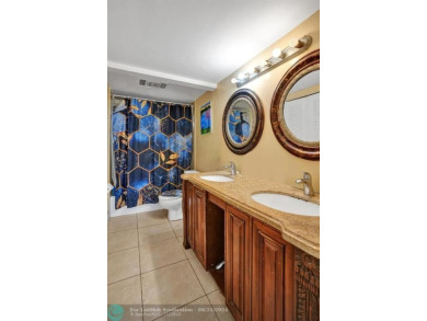 Spacious 2 bed, 2 bath condo with a private balcony and golf on Inverrary Country Club in Florida - for sale on GolfHomes.com, golf home, golf lot