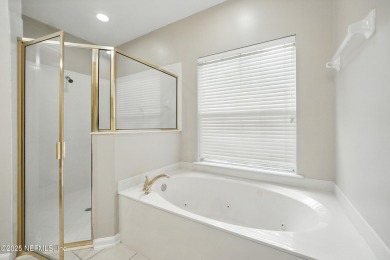 If you enjoy socializing and entertaining, this five-bedroom on Queens Harbour Yacht and Country Club in Florida - for sale on GolfHomes.com, golf home, golf lot