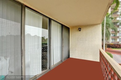 Spacious 2 bed, 2 bath condo with a private balcony and golf on Inverrary Country Club in Florida - for sale on GolfHomes.com, golf home, golf lot