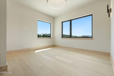 Situated amongst the serene grandeur of Granby Ranch, this on Headwaters Golf Course At Granby Ranch in Colorado - for sale on GolfHomes.com, golf home, golf lot