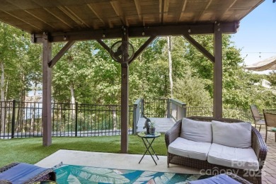 Experience lakefront living in this stunning 4-bedroom, 3.5-bath on The Palisades Country Club in North Carolina - for sale on GolfHomes.com, golf home, golf lot