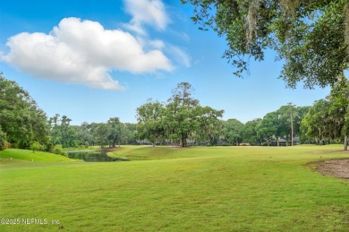 If you enjoy socializing and entertaining, this five-bedroom on Queens Harbour Yacht and Country Club in Florida - for sale on GolfHomes.com, golf home, golf lot