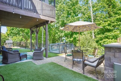 Experience lakefront living in this stunning 4-bedroom, 3.5-bath on The Palisades Country Club in North Carolina - for sale on GolfHomes.com, golf home, golf lot