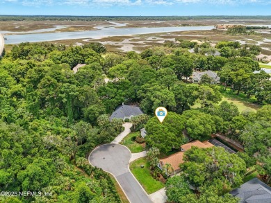 If you enjoy socializing and entertaining, this five-bedroom on Queens Harbour Yacht and Country Club in Florida - for sale on GolfHomes.com, golf home, golf lot