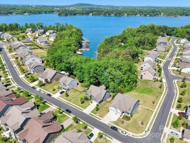 Experience lakefront living in this stunning 4-bedroom, 3.5-bath on The Palisades Country Club in North Carolina - for sale on GolfHomes.com, golf home, golf lot
