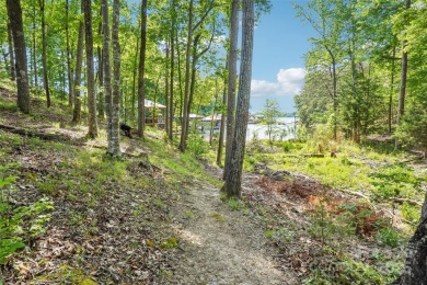 Experience lakefront living in this stunning 4-bedroom, 3.5-bath on The Palisades Country Club in North Carolina - for sale on GolfHomes.com, golf home, golf lot