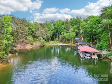 Experience lakefront living in this stunning 4-bedroom, 3.5-bath on The Palisades Country Club in North Carolina - for sale on GolfHomes.com, golf home, golf lot