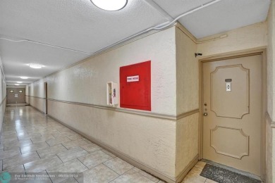 Spacious 2 bed, 2 bath condo with a private balcony and golf on Inverrary Country Club in Florida - for sale on GolfHomes.com, golf home, golf lot