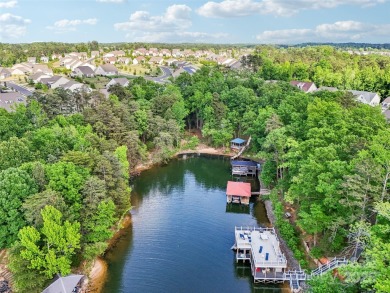 Experience lakefront living in this stunning 4-bedroom, 3.5-bath on The Palisades Country Club in North Carolina - for sale on GolfHomes.com, golf home, golf lot