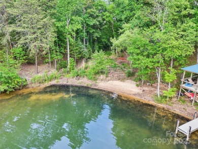 Experience lakefront living in this stunning 4-bedroom, 3.5-bath on The Palisades Country Club in North Carolina - for sale on GolfHomes.com, golf home, golf lot