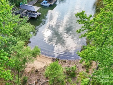 Experience lakefront living in this stunning 4-bedroom, 3.5-bath on The Palisades Country Club in North Carolina - for sale on GolfHomes.com, golf home, golf lot