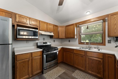 Adorable and well maintained 3 bed, 3 bath bilevel located on a on Lakes of the Four Seasons Country Club in Indiana - for sale on GolfHomes.com, golf home, golf lot