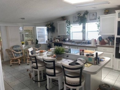 Discover this stunning triple-wide manufactured home in on Schalamar Creek Golf and Country Club in Florida - for sale on GolfHomes.com, golf home, golf lot