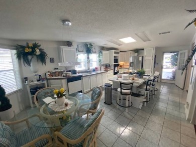 Discover this stunning triple-wide manufactured home in on Schalamar Creek Golf and Country Club in Florida - for sale on GolfHomes.com, golf home, golf lot