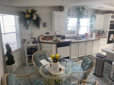 Discover this stunning triple-wide manufactured home in on Schalamar Creek Golf and Country Club in Florida - for sale on GolfHomes.com, golf home, golf lot