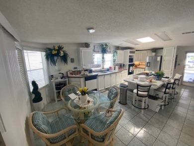 Discover this stunning triple-wide manufactured home in on Schalamar Creek Golf and Country Club in Florida - for sale on GolfHomes.com, golf home, golf lot