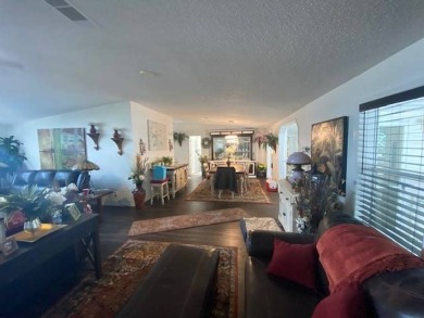 Discover this stunning triple-wide manufactured home in on Schalamar Creek Golf and Country Club in Florida - for sale on GolfHomes.com, golf home, golf lot