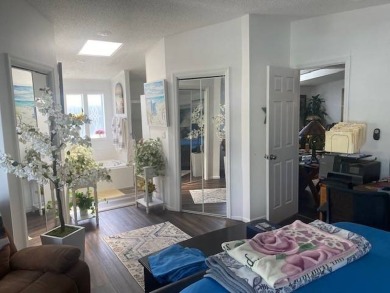 Discover this stunning triple-wide manufactured home in on Schalamar Creek Golf and Country Club in Florida - for sale on GolfHomes.com, golf home, golf lot