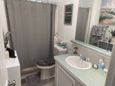 Discover this stunning triple-wide manufactured home in on Schalamar Creek Golf and Country Club in Florida - for sale on GolfHomes.com, golf home, golf lot