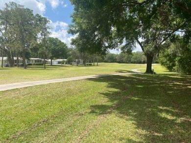 Discover this stunning triple-wide manufactured home in on Schalamar Creek Golf and Country Club in Florida - for sale on GolfHomes.com, golf home, golf lot