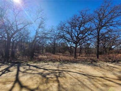 Great building site with mature shade trees, .62 of an acre on Nocona Hills Golf Course in Texas - for sale on GolfHomes.com, golf home, golf lot