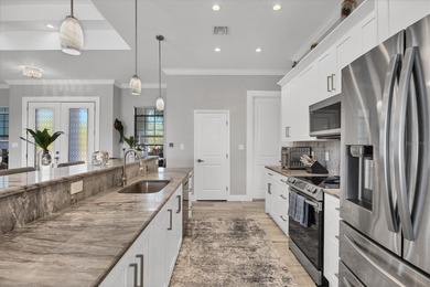 WATERFRONT POOL HOME WITH GULF ACCESS in South Gulf Cove! on Rotonda Golf and Country Club - Long Marsh  in Florida - for sale on GolfHomes.com, golf home, golf lot