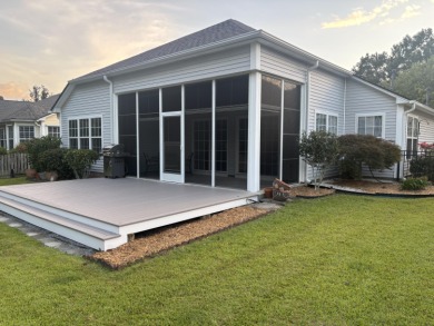 Imagine morning coffee on your back deck. Stillness. The pond on Charleston National Golf Club in South Carolina - for sale on GolfHomes.com, golf home, golf lot