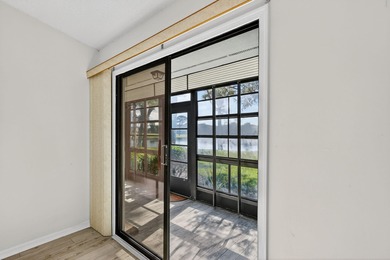 Enjoy stunning lake and golf course views right from your living on Heritage Ridge Golf Club in Florida - for sale on GolfHomes.com, golf home, golf lot