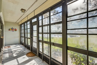 Enjoy stunning lake and golf course views right from your living on Heritage Ridge Golf Club in Florida - for sale on GolfHomes.com, golf home, golf lot