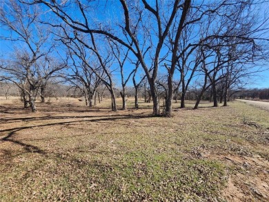 Just under an acre building site lot with mature oak trees  to on Nocona Hills Golf Course in Texas - for sale on GolfHomes.com, golf home, golf lot