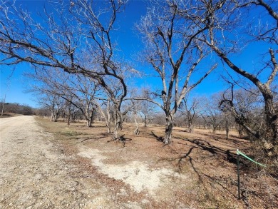 Just under an acre building site lot with mature oak trees  to on Nocona Hills Golf Course in Texas - for sale on GolfHomes.com, golf home, golf lot