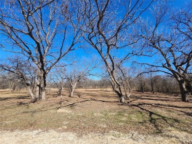 Just under an acre building site lot with mature oak trees  to on Nocona Hills Golf Course in Texas - for sale on GolfHomes.com, golf home, golf lot