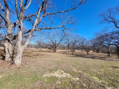 Just under an acre building site lot with mature oak trees  to on Nocona Hills Golf Course in Texas - for sale on GolfHomes.com, golf home, golf lot