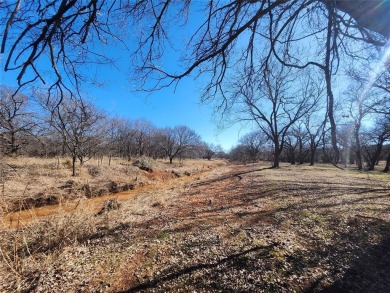 Just under an acre building site lot with mature oak trees  to on Nocona Hills Golf Course in Texas - for sale on GolfHomes.com, golf home, golf lot