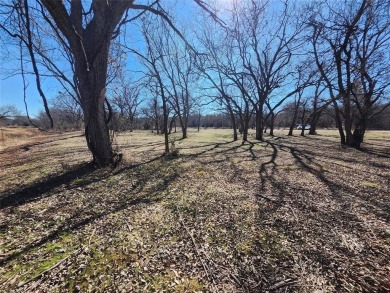 Just under an acre building site lot with mature oak trees  to on Nocona Hills Golf Course in Texas - for sale on GolfHomes.com, golf home, golf lot