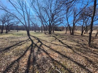 Just under an acre building site lot with mature oak trees  to on Nocona Hills Golf Course in Texas - for sale on GolfHomes.com, golf home, golf lot