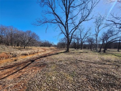 Just under an acre building site lot with mature oak trees  to on Nocona Hills Golf Course in Texas - for sale on GolfHomes.com, golf home, golf lot