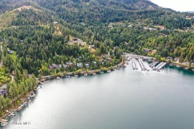 Discover this exceptional pie-shaped lot offering breathtaking on Hayden Lake Country Club in Idaho - for sale on GolfHomes.com, golf home, golf lot